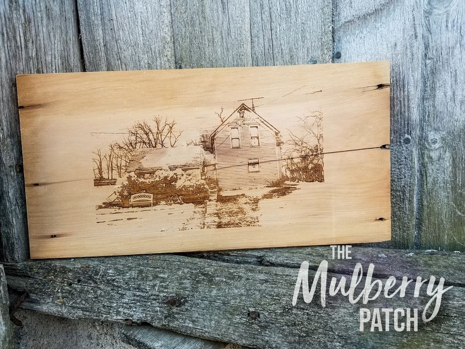 laser engraved wood piece with the farm scene