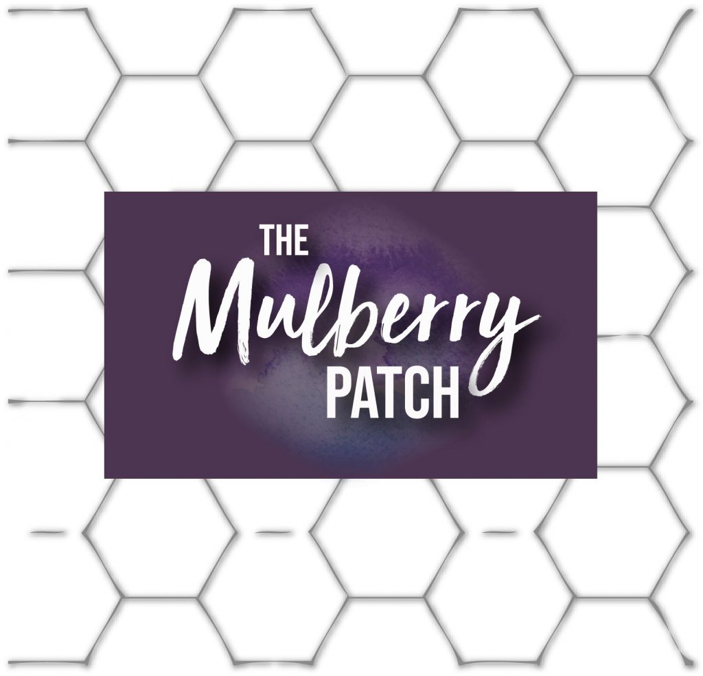 The Mulberry Patch in white writing, on top of a purple rectangle, on top of white hexagons with black edges